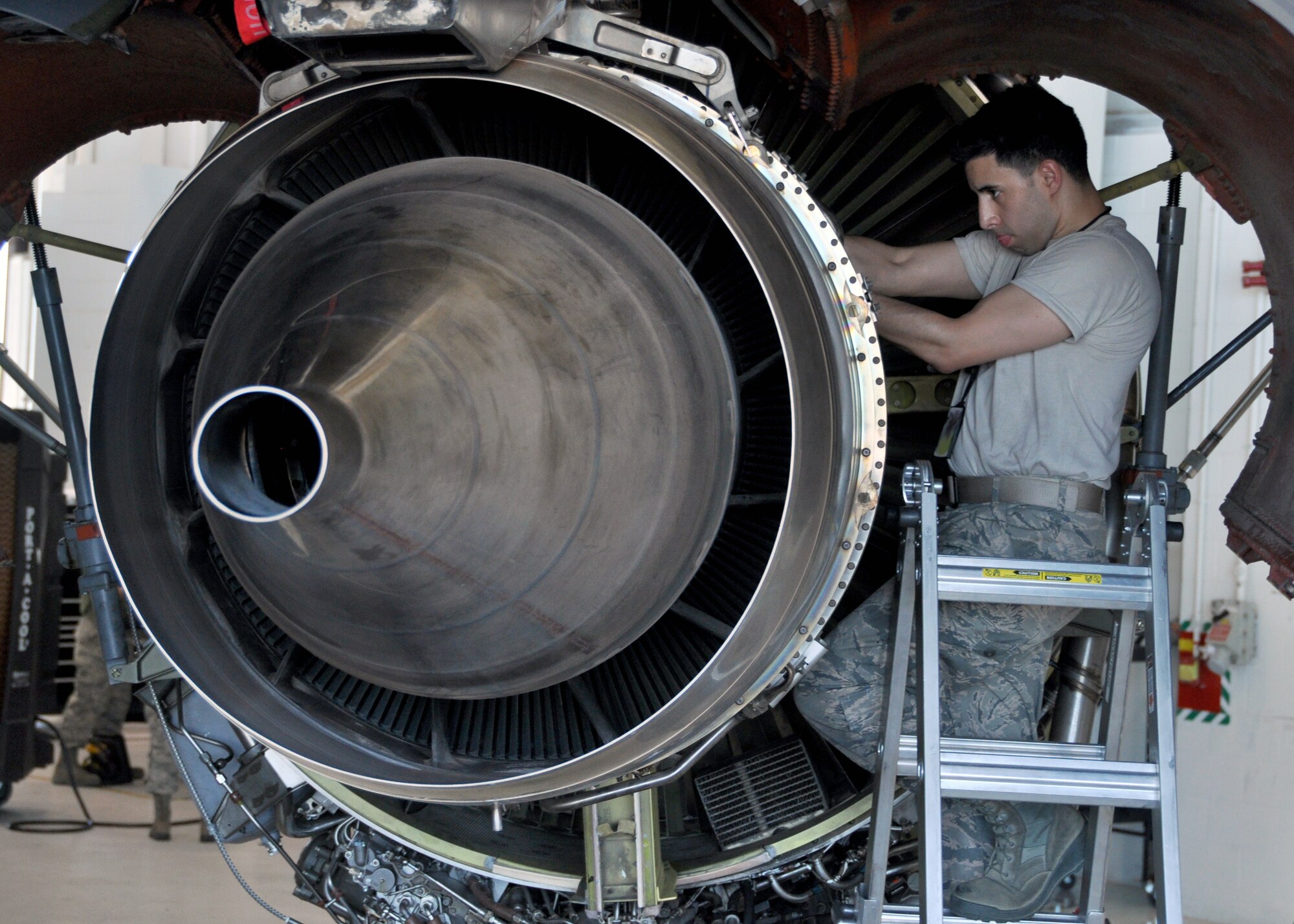 Airman First Class Joshua Albarracin, 931st Maintenance Squadron journeyman, replaces a fuel nozzle on a KC-135 Stratotanker engine July 9, 2016, McConnell Air Force Base, Kan. Airmen with the 931st Air Refueling Wing and 22 ARW worked hand-in-hand during the Unit Training Assembly to complete inspections and maintenance of the aircraft. (U.S. Air Force photo by Senior Airman Preston Webb)