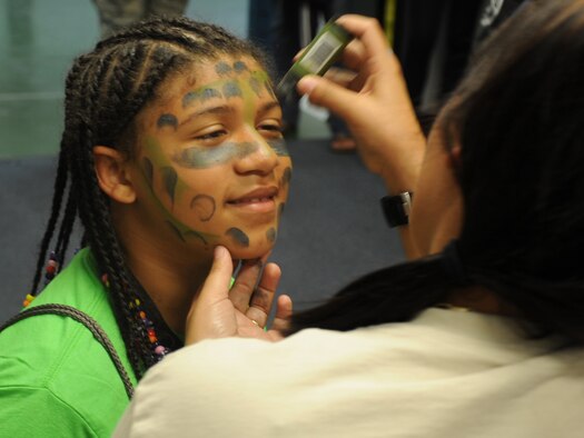 Eleven-year-old Triniaty Williams prepares for a mock deployment during Operation KUDOs, or Kids Understanding Deployment Operations, July 9, 2016, at McChord Field. 
