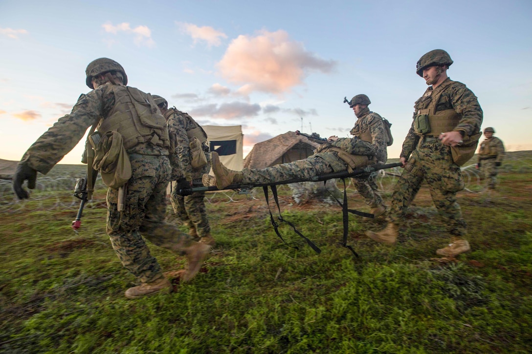 Marines and sailors carry simulated casualties during Exercise Hamel at the Cultana Training Area in Australia, July 8, 2016. Exercise Hamel is a trilateral training exercise with  U.S., Australian and New Zealand forces designed to enhance cooperation, trust and friendship. Marine Corps photo by Lance Cpl. Osvaldo L. Ortega III