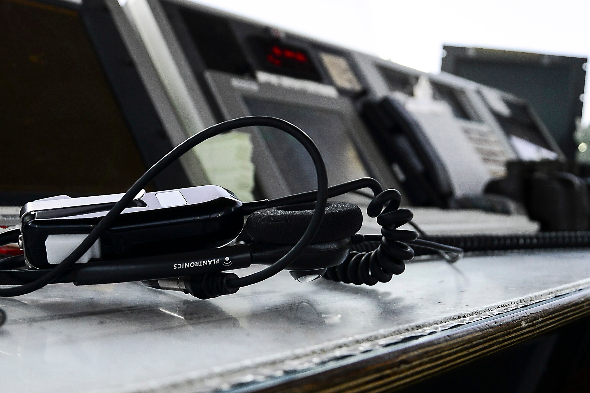Headgear, which includes one headphone and one microphone, is donned by each 379th Expeditionary Operations Support Squadron Air Traffic Control member as a means of communication at Al Udeid Air Base, Qatar, June 13, 2016. The ATC members communicate with the incoming and outgoing aircraft, the local airport as well as any motorized vehicle on the flight line for the safe and orderly handling of aircraft.  (U.S. Air Force photo by Senior Airman Kimberly Nagle) 