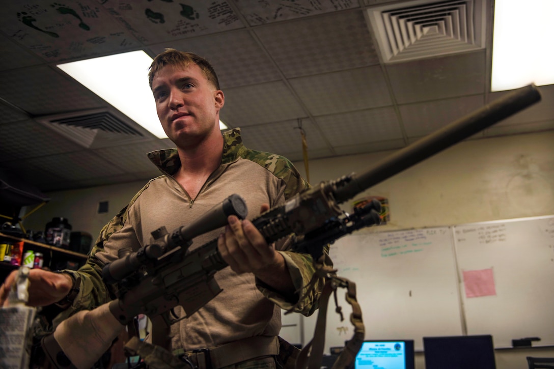 Senior Airman Jarad Frey conducts a functions check on his weapon before participating in a personnel recovery exercise at Bagram Airfield, Afghanistan, July 9, 2016. Frey is a pararescueman assigned to the 83rd Expeditionary Rescue Squadron. Air Force photo by Senior Airman Justyn M. Freeman