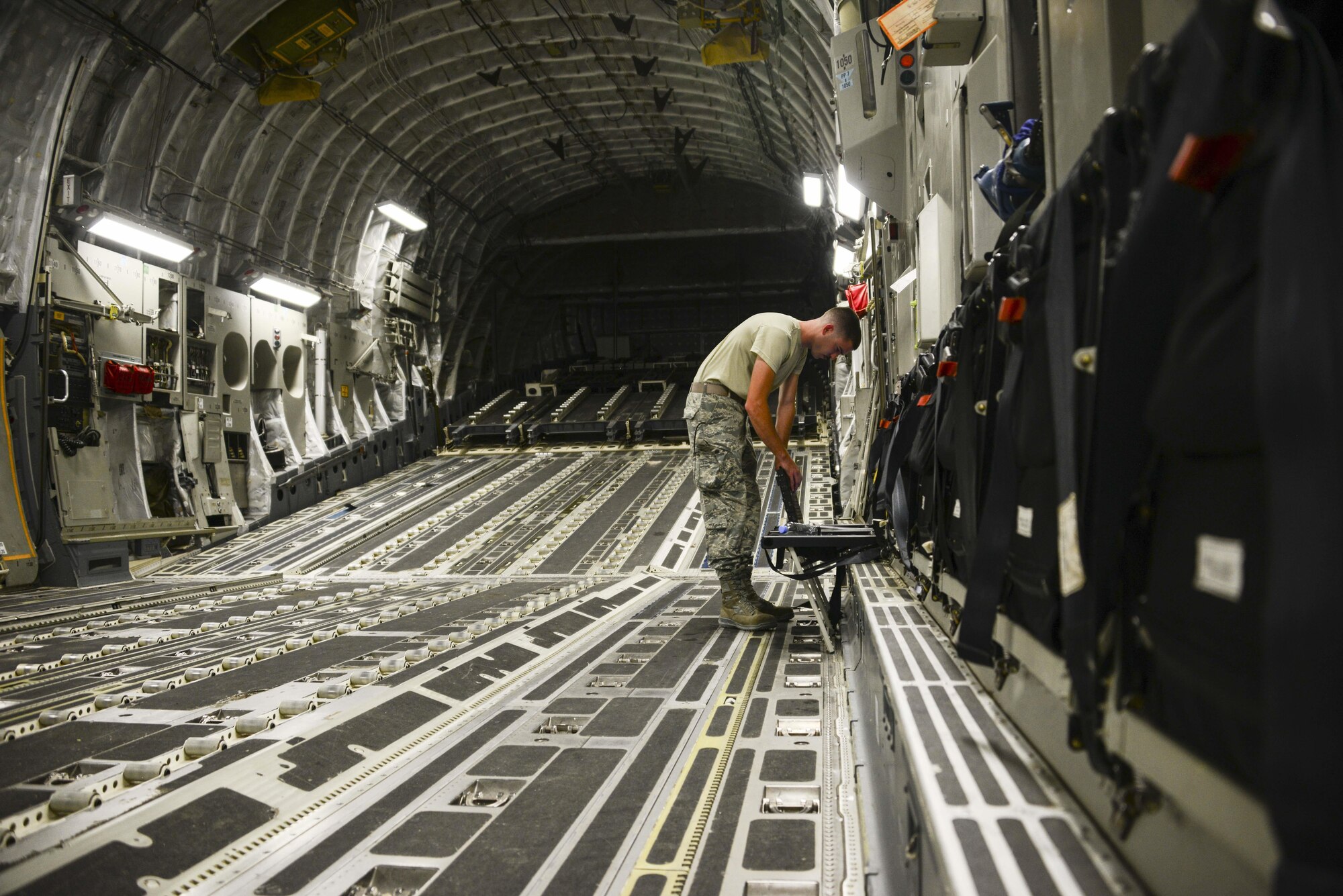 Staff Sgt. Josh Budinich, 8th Expeditionary Air Mobility Squadron, Aircraft Maintenance Flight aero repair craftsman, prepares his checklist prior to inspecting a C-17 Globemaster III June 30, 2016, at Al Udeid Air Base, Qatar. The 8th EAMS contains Aerial Port Flight and Aircraft Maintenance Flight. MXA Airmen maintain the most technically advanced cargo airlift aircraft in the world as the largest enroute unit in the U.S. Air Forces Central Command area of responsibility. They refuel and launch C-17s, C-5 Galaxies and Boeing 777, 767 and 747 aircraft. (U.S. Air Force photo/Senior Airman Janelle Patiño/Released)
