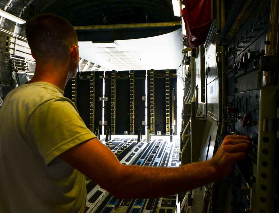 Staff Sgt. Josh Budinich, 8th Expeditionary Air Mobility Squadron, Aircraft Maintenance Flight aero repair craftsman, controls the C-17 Globemaster III cargo ramp and door during a preflight inspection June 30, 2016, at Al Udeid Air Base, Qatar. Airmen from MXA spend approximately three hours inspecting and ensuring the aircraft is mission ready prior to each flight. The 8 EAMS provides airlift support to units across the U.S. Air Forces Central Command area of responsibility. (U.S. Air Force photo/Senior Airman Janelle Patiño/Released)