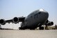 A C-17 Globemaster III sits on the flight line while Airmen from the 8th Expeditionary Air Mobility Squadron, Aircraft Maintenance Flight finish their preflight inspection June 30, 2016, at Al Udeid Air Base, Qatar. The 8th EAMS provides airlift capability to units across the U.S. Air Forces Central Command area of responsibility in support of Operation Inherent Resolve, Operation Freedom's Sentinel and Combined Joint Task Force - Horn of Africa. (U.S. Air Force photo/Senior Airman Janelle Patiño/Released)