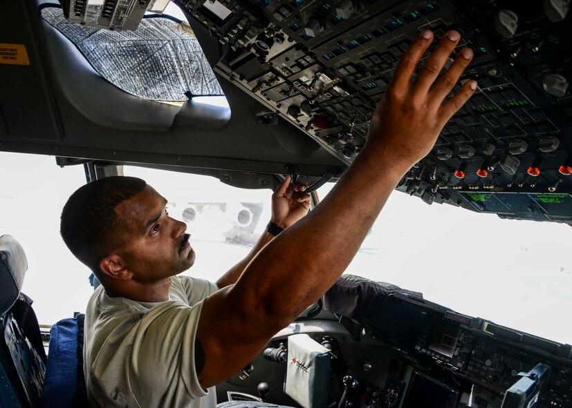 Staff Sgt. Benjamin Taylor, 8th Expeditionary Air Mobility Squadron, Aircraft Maintenance Flight (MXA) instruments and flight controls craftsman, turns on the hydraulics systems during a hydraulic preflight inspection on a C-17 Globemaster III June 30, 2016, at Al Udeid Air Base, Qatar. MXA Airmen maintain the most technically advanced cargo airlift aircraft in the world as the largest enroute unit in the U.S. Air Forces Central Command area of responsibility. They maintain both C-17 Globemaster III and C-5 Galaxy coming in and out of the base as well as commercial aircraft. (U.S. Air Force photo/Senior Airman Janelle Patiño/Released)