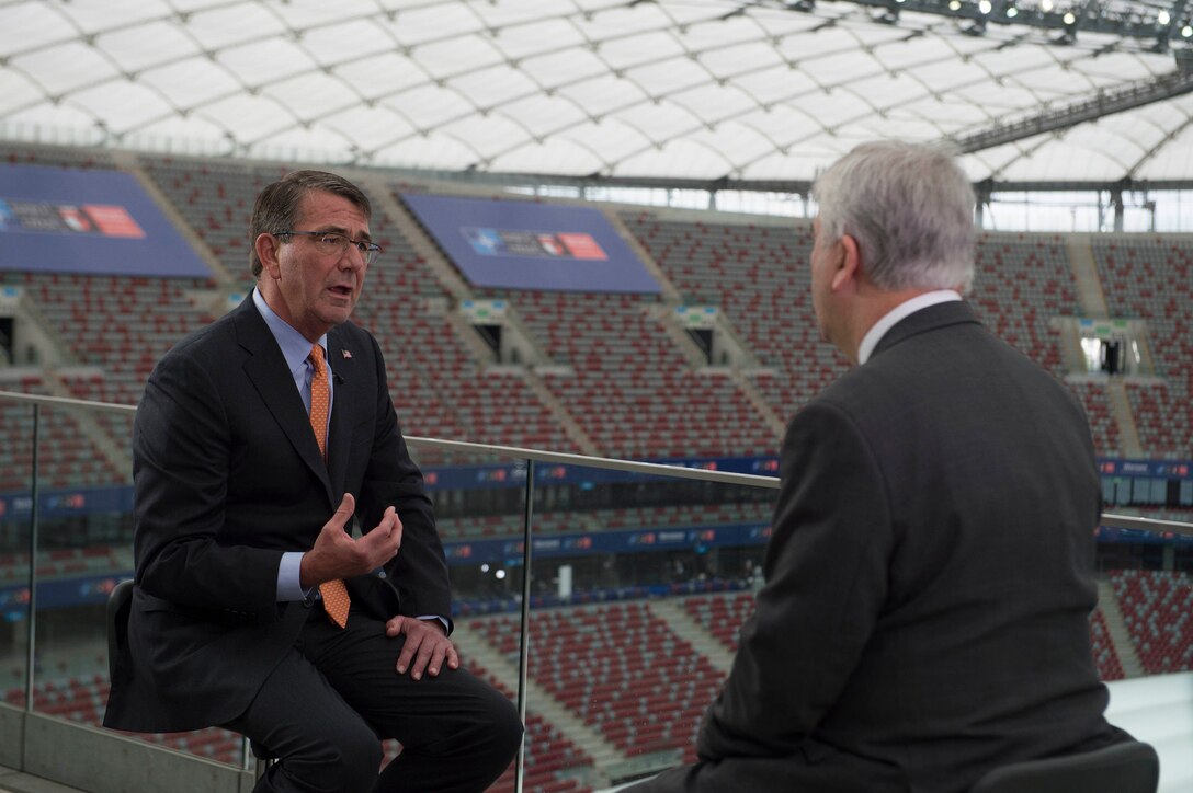 Defense Secretary Ash Carter, left, talks with a BBC reporter during an interview at the NATO summit in Warsaw, Poland, July 9, 2016. DoD photo by Navy Petty Officer 1st Class Tim D. Godbee