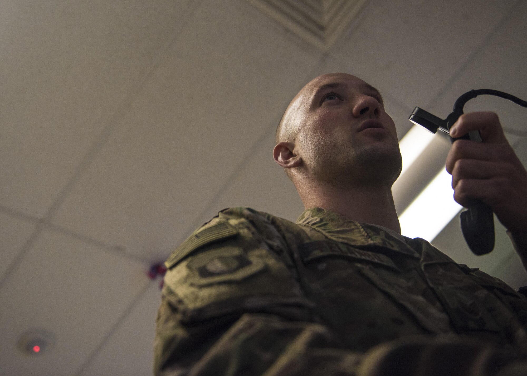 Staff Sgt. Scott Felando, 455th Air Expeditionary Wing command post controller, receives aircraft download information, July 11, 2016, Bagram Airfield, Afghanistan. The 455th AEW command post receives all aircraft download information for the purpose of coordinating flightline operations. (U.S. Air Force photo by Senior Airman Justyn M. Freeman)