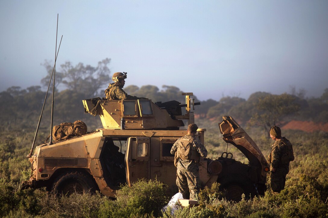 Marines check the engine on a Humvee during Exercise Hamel at the Cultana Training Area in Australia, July 8, 2016. The Marines are assigned to Weapons Company, 1st Battalion, 1st Marine Regiment, Marine Rotational Force Darwin. Exercise Hamel is a trilateral training exercise with U.S., Australian and New Zealand forces designed to enhance cooperation, trust and friendship. Marine Corps photo by Cpl. Carlos Cruz Jr.