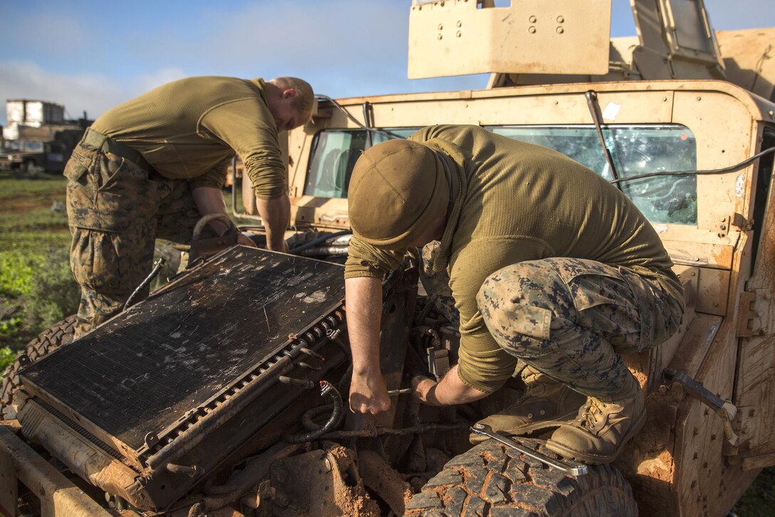 Marines conduct field maintenance on a Humvee during Exercise Hamel at the Cultana Training Area in Australia, July 8, 2016. The Marines are assigned to Headquarters and Service Company, 1st Battalion, 1st Marine Regiment, Marine Rotational Force Darwin. Marine Corps photo by Cpl. Mandaline Hatch