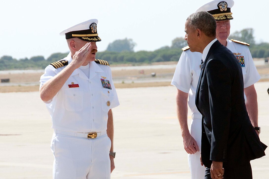 Navy Capt. Michael MacNicholl, Naval Station Rota’s commanding officer, renders honors to President Barack Obama as he arrives at the naval base in Spain, July 10, 2016. Navy photo by Petty Officer 1st Class Brian Dietrick