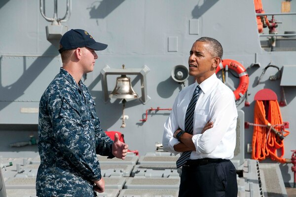 Navy Petty Officer 2nd Class Garrett Nelson speaks with President Barack Obama during his visit to the USS Ross at Naval Station Rota, Spain, July 10, 2016. Navy photo by Petty Officer 1st Class Brian Dietrick