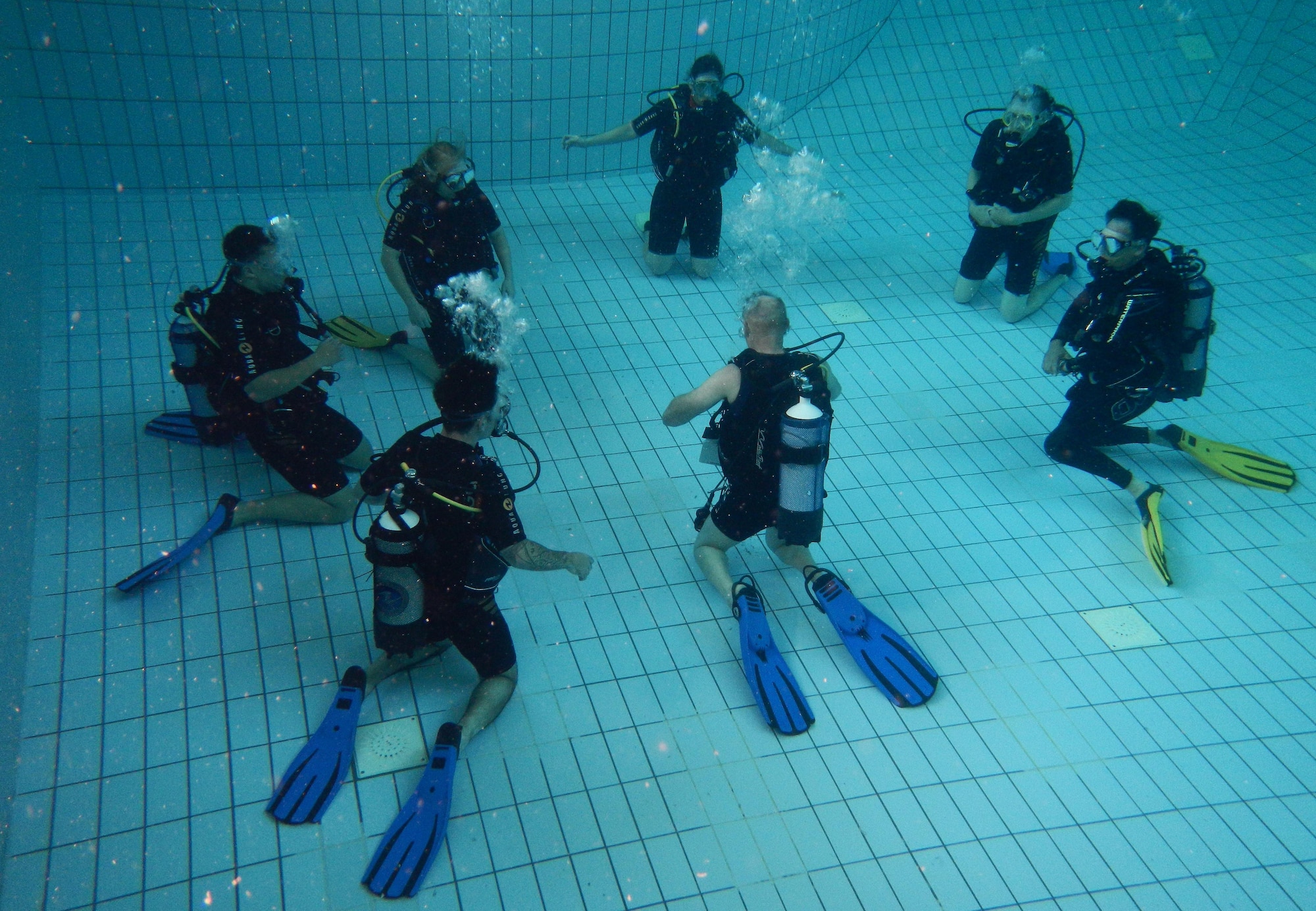 Erhard Bauman, Ramstein Aquatic Center’s Professional Association of Diving Instructors open water certification instructor, teaches students during hands-on training July 7, 2016, at Ramstein Air Base, Germany. The course includes four days of classroom and hands-on application in a pool and two days in open water at a lake. (U.S. Air Force photo/Airman 1st Class Tryphena Mayhugh)