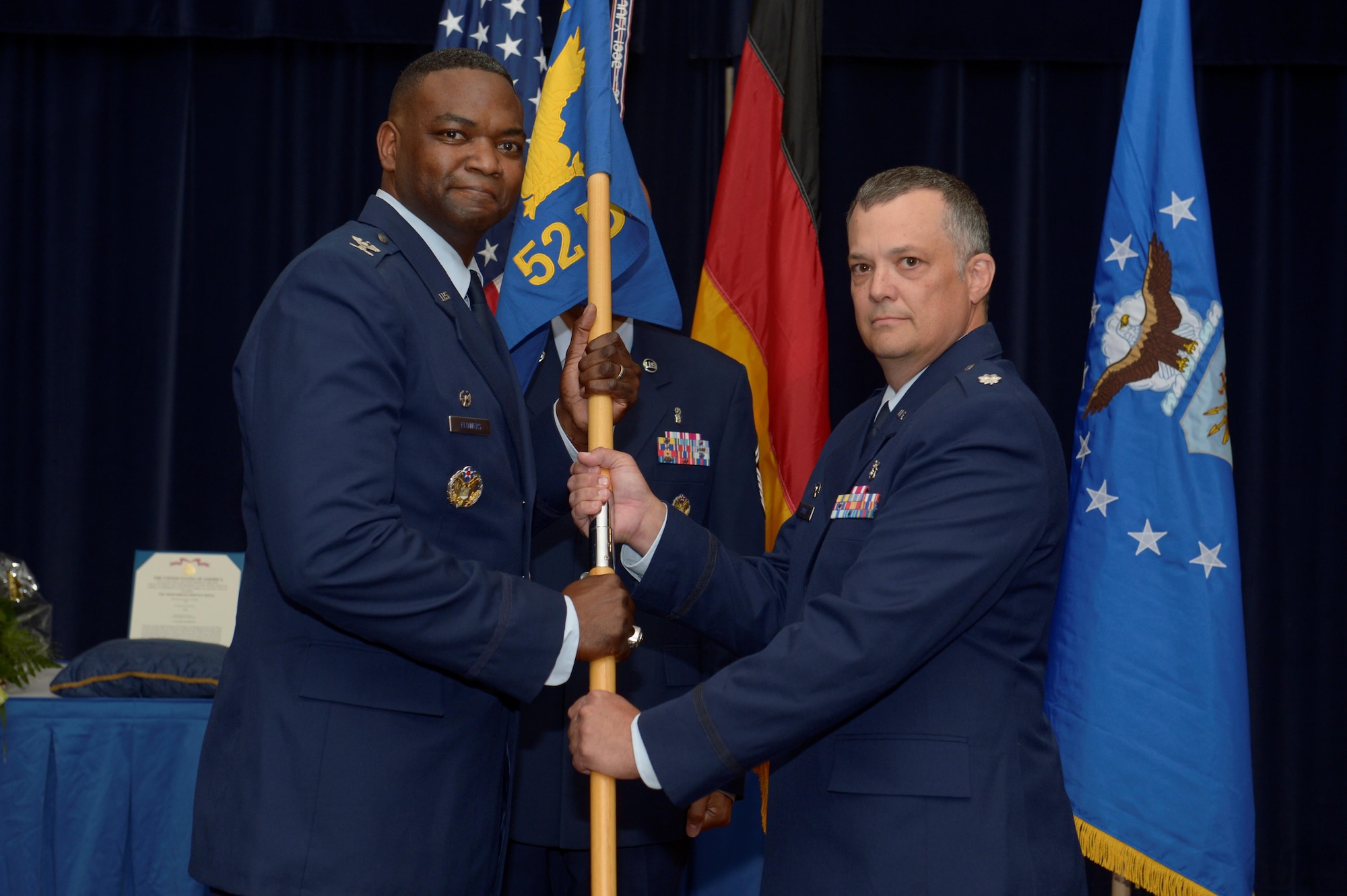 U.S. Air Force Col. Alfred Flowers, 52nd Medical Group commander, left, gives the ceremonial guidon to U.S. Air Force Lt. Col. David Jones, incoming 52nd Dental Squadron
commander, during the 52nd DS change of command ceremony on Spangdahlem Air Base, Germany, July 11, 2016. (U.S. Air Force photo by Staff Sgt. Jonathan Snyder/Released)