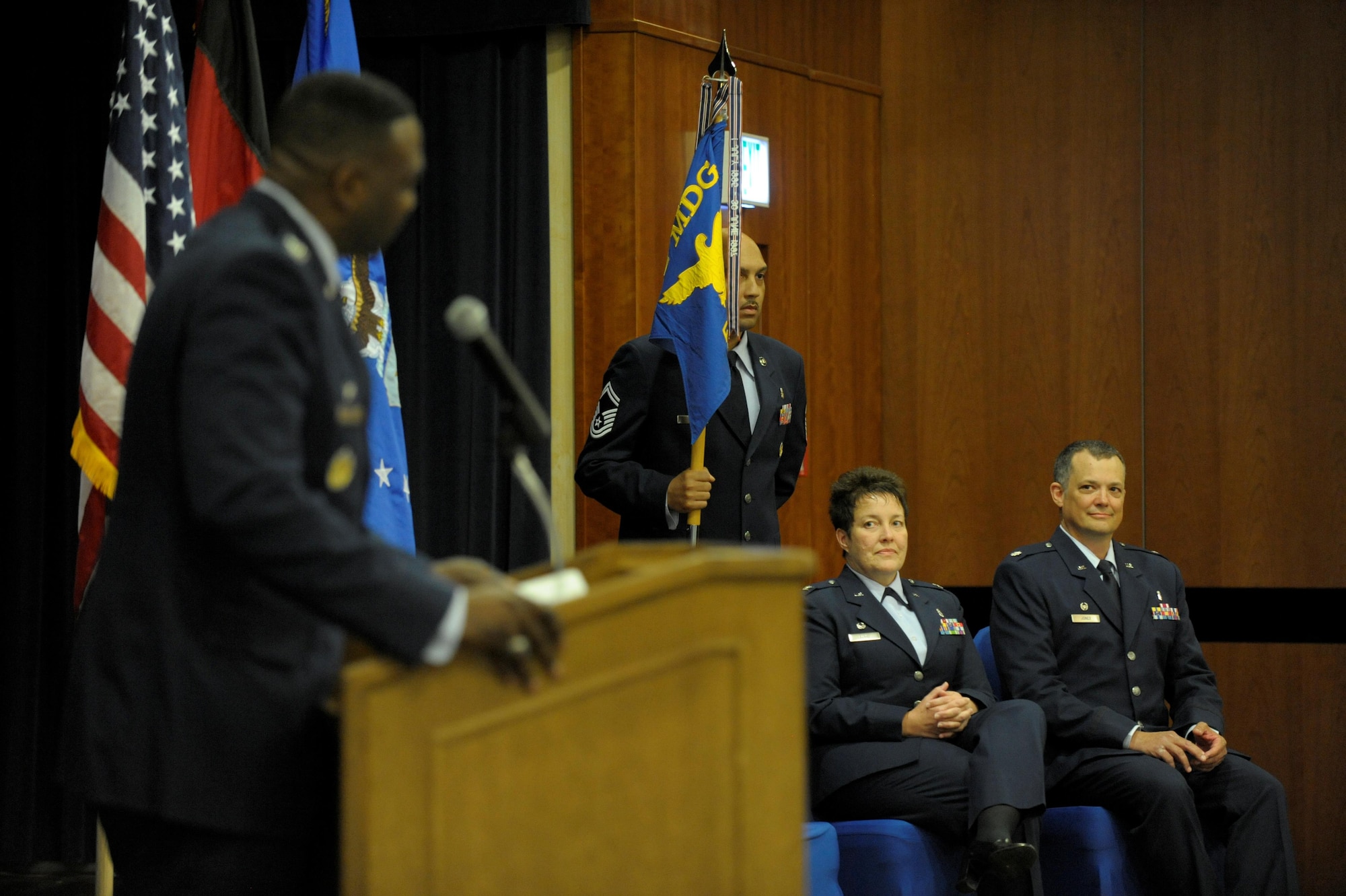 U.S. Air Force Col. Alfred Flowers, 52nd Medical Group commander, speaks during the 52nd DS change of command ceremony on Spangdahlem Air Base, Germany, July 11, 2016. During Flowers speech he says his farewells to Col. Ann Blake and her family as well as welcomed Lt. Col. David Jones and his family. (U.S. Air Force photo by Staff Sgt. Jonathan Snyder/Released)