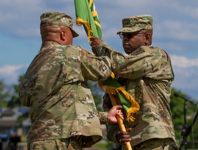 Maj. Gen. Phillip M. Churn, the commanding general for the 200th Military Police Command, receives the unit’s colors from Cammand Sgt. Maj. Craig Owens, during Churn’s relinquishment of command ceremony at the McGlachlin Parade Field, on Fort Meade, Md., July 10, 2016.  Approximately 200 Soldiers from the command’s subordinate units attended the ceremony. The passing of the colors is a time-honored military tradition, which is symbolic of passing on the unit’s history and achievements, as well as the unit’s future. (U.S. Army Photo by Sgt. Audrey Hayes)