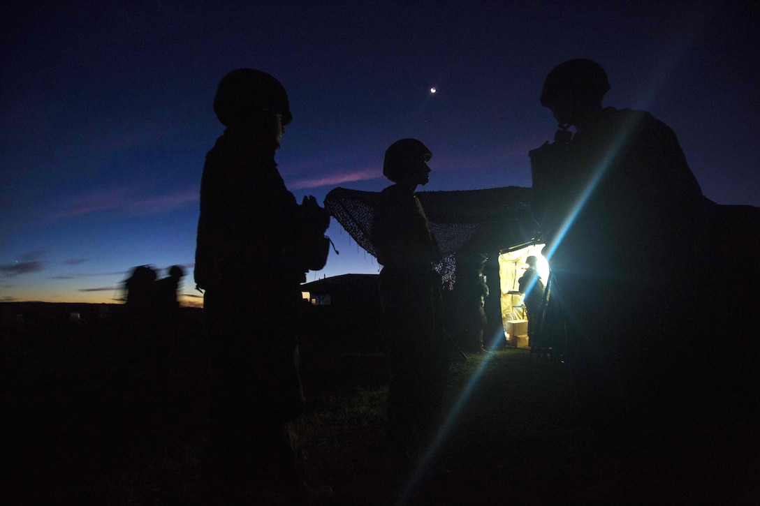 Marines wait for transport after a simulated attack during Exercise Hamel at the Cultana Training Area in Australia, July 8, 2016. Marine Corps photo by Lance Cpl. Osvaldo L. Ortega III