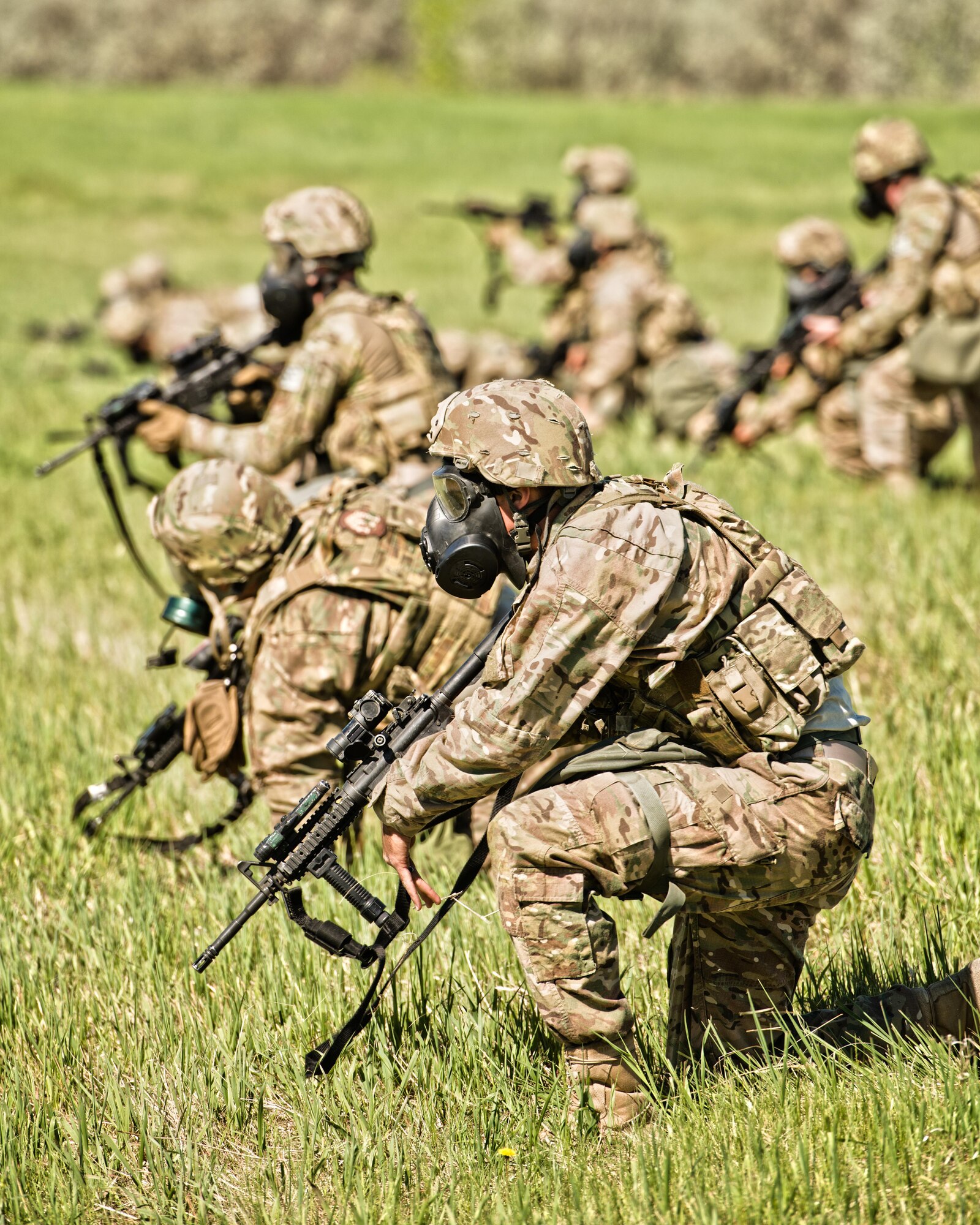 Defenders from the 791st Missile Security Forces Squadron participated in annual tactical training at Minot Air Force Base, N.D., May 23, 2016. Training stations allowed SF members to practice small unit combat tactics, employ inert smoke grenades and perform casualty care and evacuation. These exercises were just a small portion of the tactical maneuver training SF members receive annually. (U.S. Air Force photo/Airman 1st Class J.T. Armstrong)