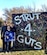 The family of Maj. Patrick Cain, 22nd Maintenance Squadron commander, hold up a sign at the Strut-4-Guts 5k race, Nov. 14, 2015, at Wichita, Kan. Cain, an avid long distance runner, was officially declared in remission June 7, 2016, after almost a year battle with colorectal cancer. 