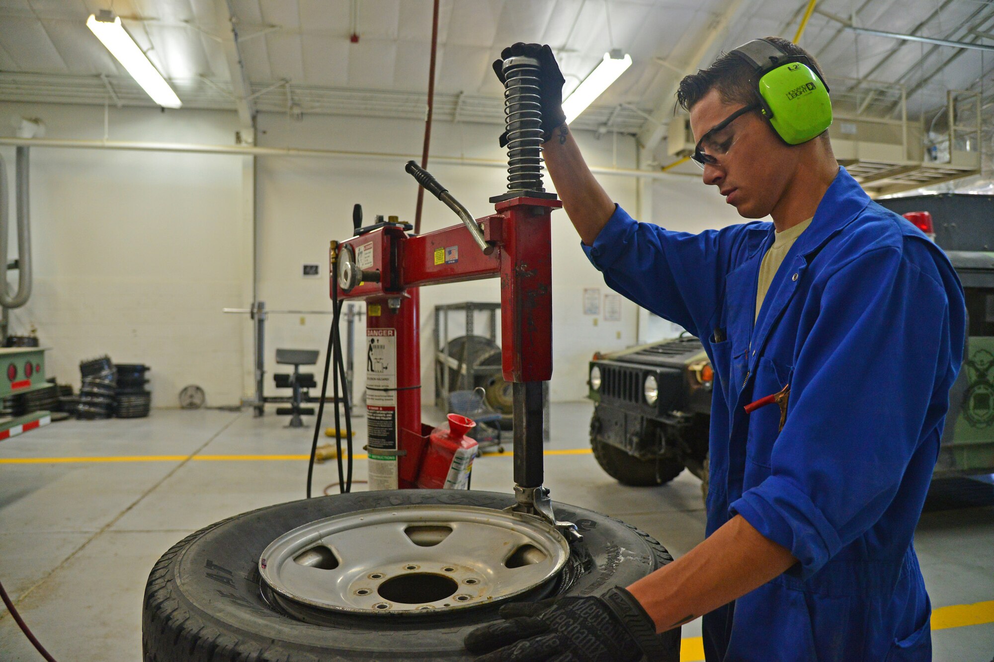 Senior Airman Brennan Popp, 341st Logistics Readiness Squadron mission generating vehicular equipment maintenance technician, mounts a tire onto a rim July 7, 2016, at Malmstrom Air Force Base, Mont. Afterwards, the wheel is filled with the correct amount of air and bolted onto a vehicle. (U.S. Air Force photo/Airman 1st Class Daniel Brosam)