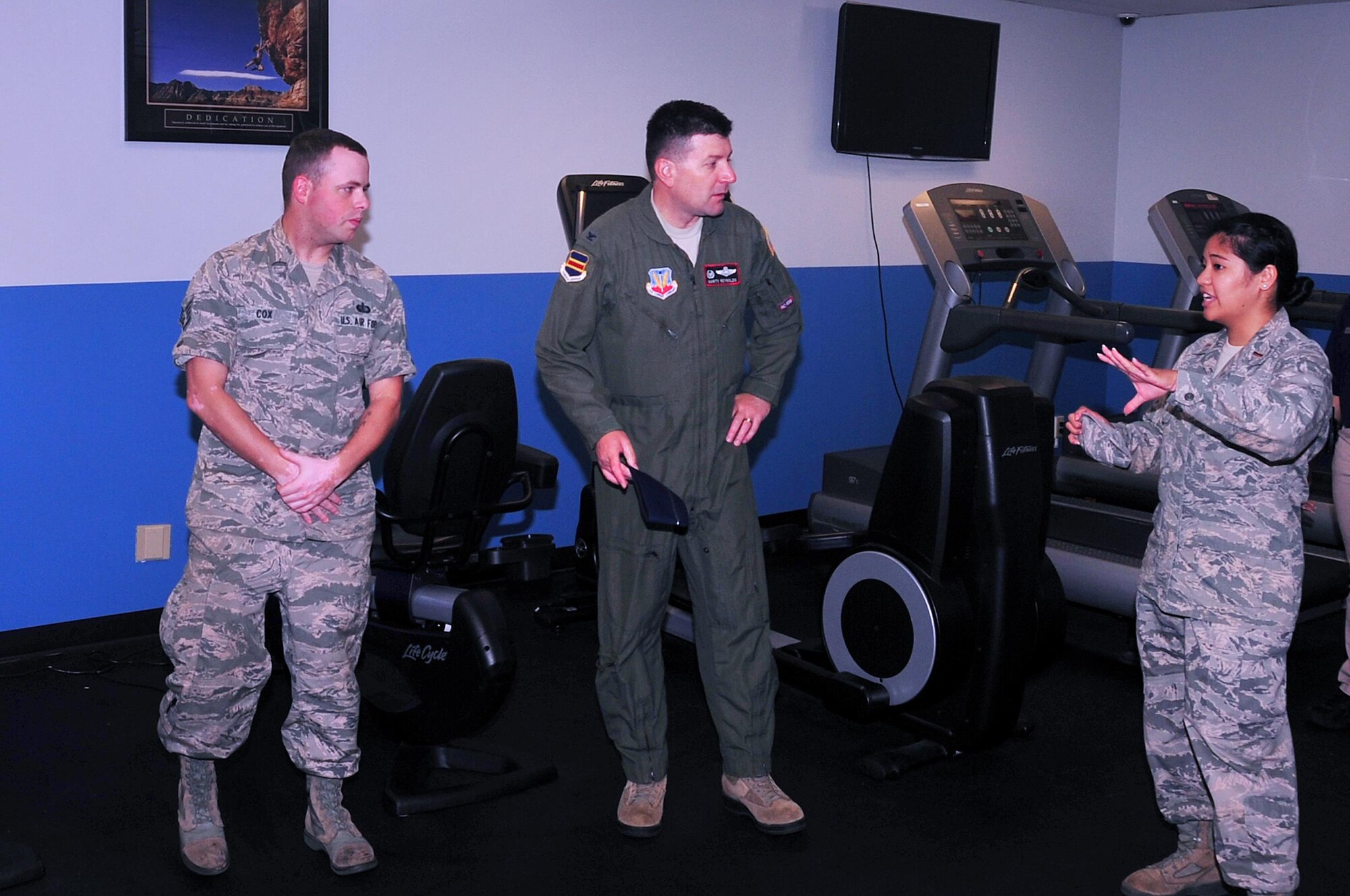 U.S. Air Force 2nd Lt. Cristina Dalida, 55th Force Support Squadron officer-in-charge of fitness and recreation, welcomes U.S. Air Force Col. Marty Reynolds, commander of the 55th Wing, to the grand opening of the after-hours gym located inside of the field house at Offutt Air Force Base, Neb, July 7, 2016.  The facility was added to align with larger Air Force health initiatives focused on living a healthy lifestyle.  (U.S. Air Force photo by D.P. Heard/Released)