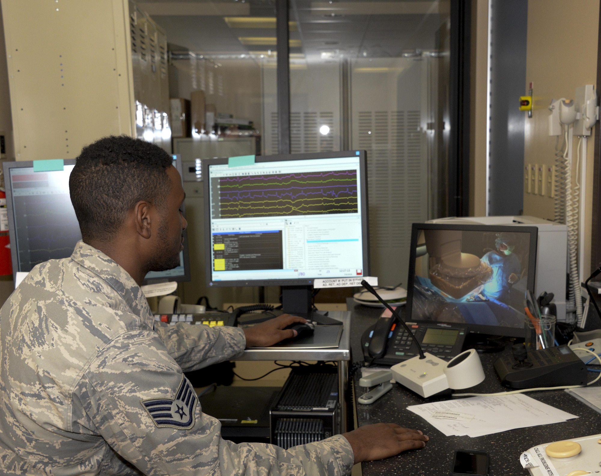 Staff Sgt. Kasaun Mims, 60th SGCS cardiopulmonary technician, monitors a patients heart during a surgery to adjust a pacemaker July 6 at David Grant USAF Medical Center. 