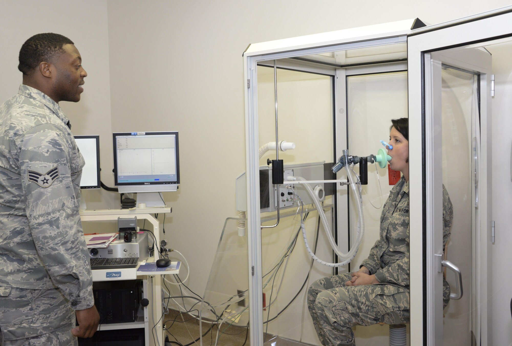 Senior Airman Kevin Jones, 60th SGCS cardiopulmonary technician, performs various tests to determine lung volumes July 6 at David Grant USAF Medical Center. 