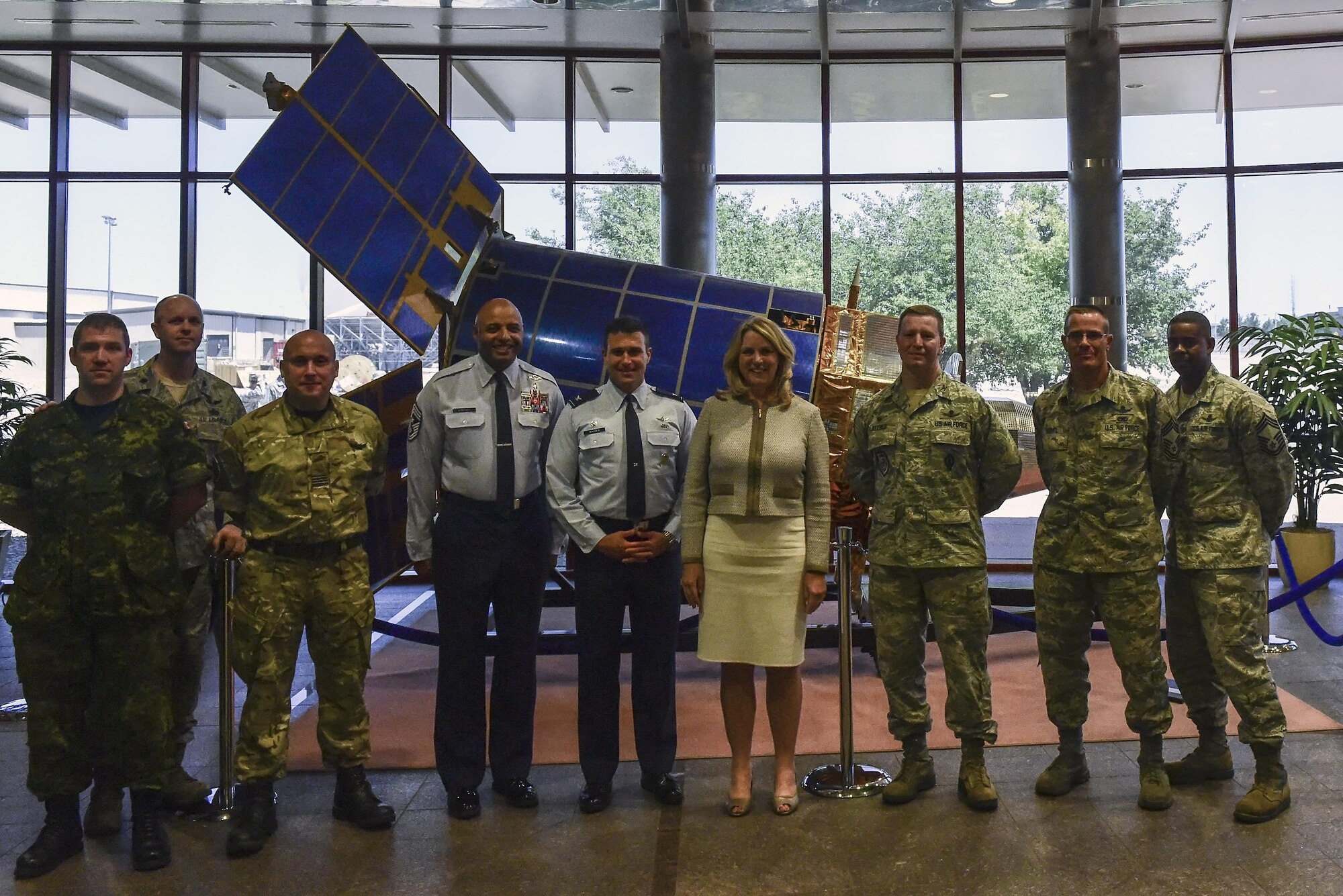 Air Force Secretary Deborah Lee James poses with 460th Space Wing leadership and foreign mission before receiving a briefing about the capabilities and missions performed by the base July 7, 2016, at Buckley Air Force Base, Colo. During her time here, James viewed the 460th Space Wing’s Mission Control Station and spoke with space operators in their work centers and on the operations floor. (U.S. Air Force photo by Tech. Sgt. Nicholas Rau)