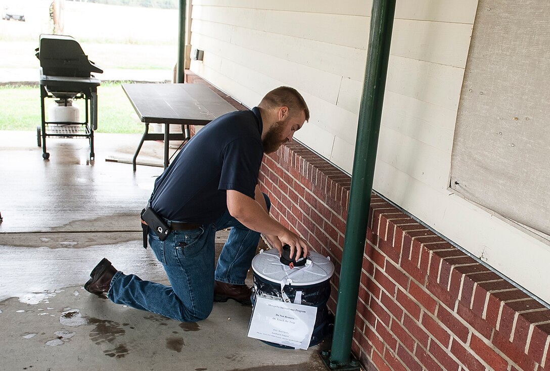Brad Sparks, a pest controller at DLA checks a mosquito trap to see if any live specimens have been captured. Each week Sparks collects the samples and sends them to a laboratory to test for the presence of the Zika virus. 