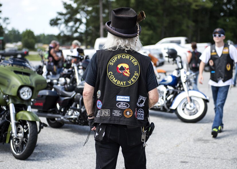 A member of the Combat Veterans Motorcycle Association’s 25-5 chapter admires motorcycles of those who gathered in honor of U.S. Air Force Tech. Sgt. Lee “Blaster” Fulp for a memorial ride, July 9, 2016, in Valdosta, Ga. Fulp, a Hahira, Ga. native, served as the NCO in charge of Explosive Ordnance Disposal for the 820th Defense Group and was an active member of the Combat Veterans Motorcycle Association’s 25-5 chapter when he passed away in a motorcycle accident, last year. (U.S. Air Force photo by Airman 1st Class Janiqua P. Robinson/Released)