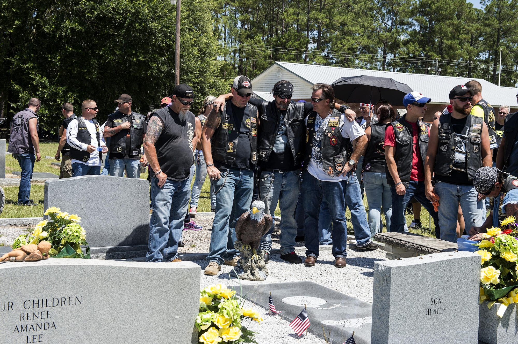 Family and friends of U.S. Air Force Tech. Sgt Lee “Blaster” Fulp share fond memories with one another during a memorial in his honor, July 9, 2016, in Cecil, Ga. More than 100 people attended the memorial for Fulp, a combat veteran who served four tours in Afghanistan and Iraq. (U.S. Air Force photo by Airman 1st Class Janiqua P. Robinson/Released)