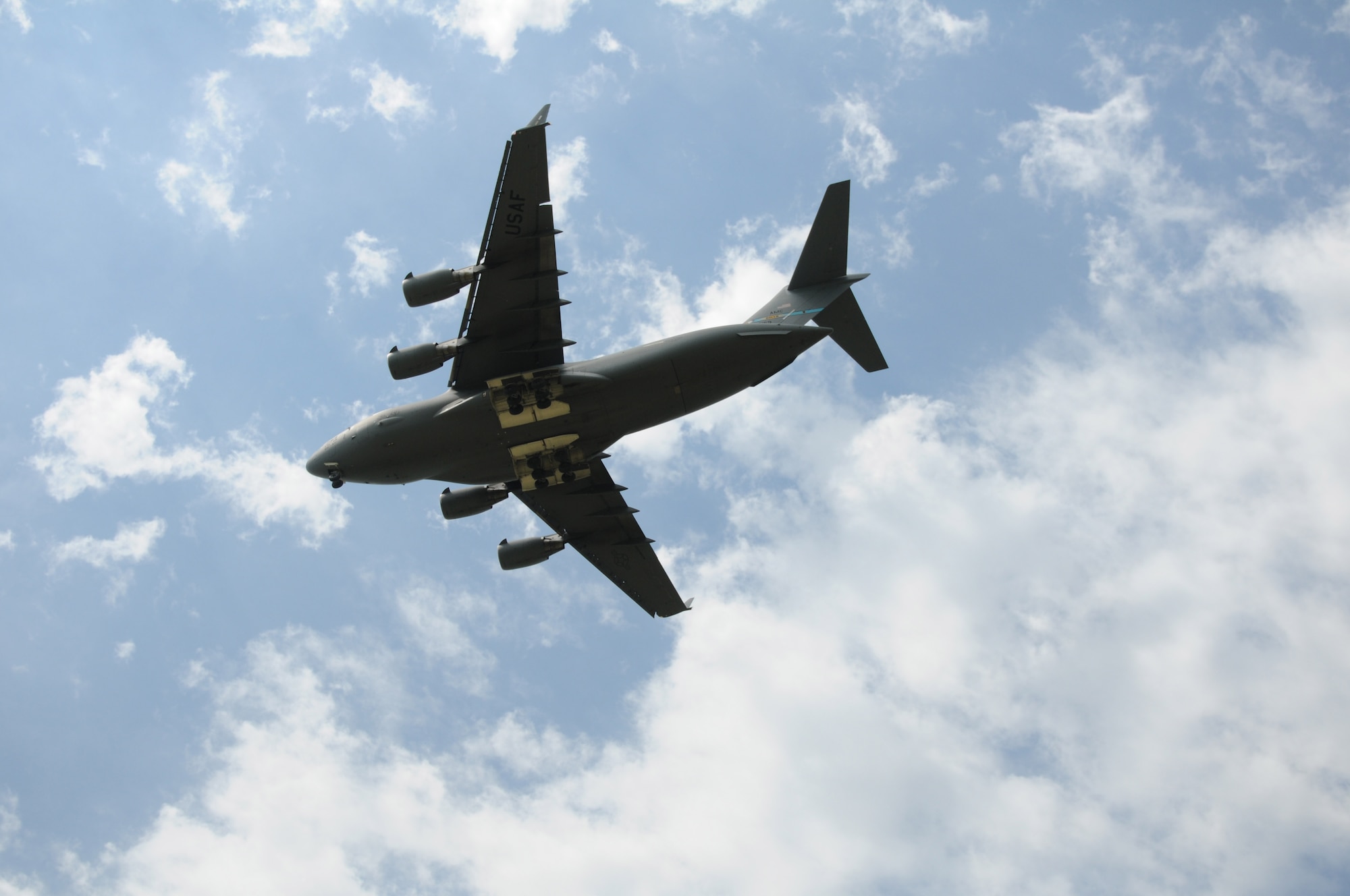 A Boeing C-17 Globemaster III operated by pilots of the 3rd Airlift Squadron, 436th Airlift Wing at Dover Air Force Base soars over Savage Airfield June 25, 2016, at Fort Riley, Kansas. Air Force personnel from the 3rd Airlift Squadron, the Air Mobility Command's Global Reach medical assessment team and an Aeromedical Evacuation team from the 514th Aeromedical Evacuation Squadron, 512th Reserve Air Mobility Wing from Joint Base McGuire-Dix-Lakehurst, N.J., traveled to Savage Field to conduct emergency deployment readiness exercises in an austere environment. (US Army photo/Season Osterfeld)