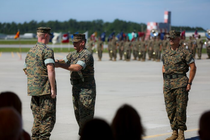 Sgt. Maj. William Oldenburg relinquished the sword of office to Sgt. Maj. Charles Metzger in a relief and appointment ceremony on Marine Corps Air Station New River July 8. Oldenburg retired after 30 years of service during a retirement ceremony after serving the Marines, sailors and civilians of MCAS New River as the senior enlisted advisor since April, 2014.