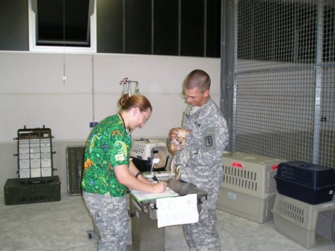 Then-Capt. Kristina McElroy in-processing newly-arrived pets in Vilseck, Germany, in 2006. (Photo Credit: courtesy)