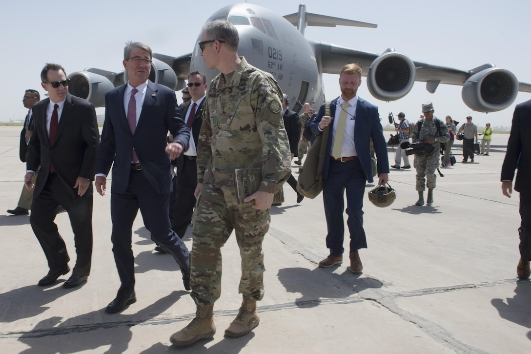 Defense Secretary Ash Carter walks with Army Lt. Gen. Sean MacFarland, commanding general of Combined Joint Task Force Operation Inherent Resolve, and U.S. Ambassador to Iraq Stuart E. Jones upon arriving in Baghdad, July 11, 2016. Carter is in Iraq to meet with government and military leaders about operations to defeat the Islamic State of Iraq and the Levant. DoD photo by Navy Petty Officer 1st Class Tim D. Godbee