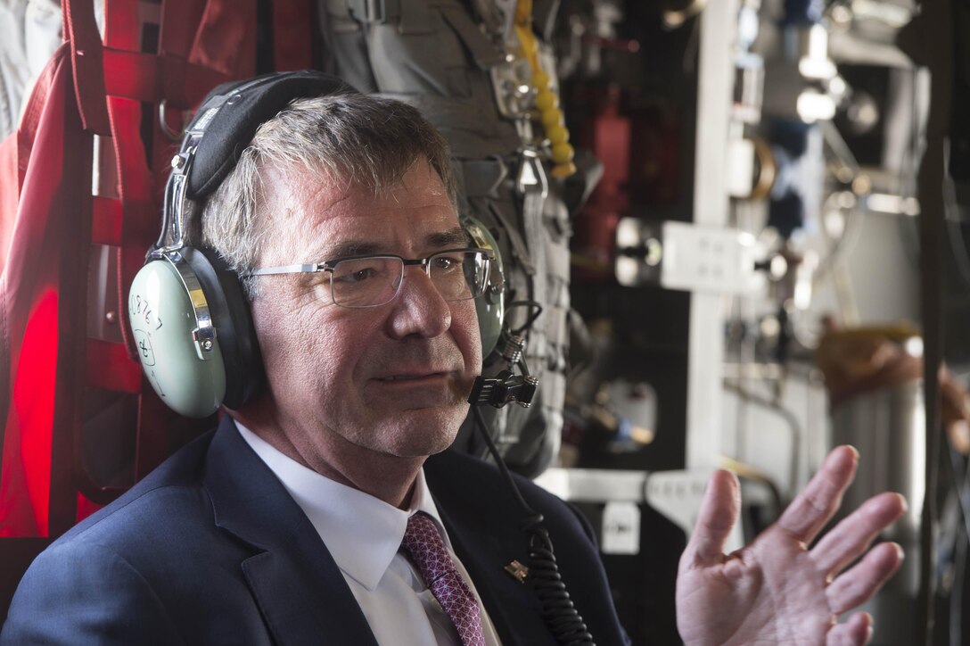 Defense Secretary Ash Carter speaks to advisors during a helicopter ride over Baghdad, July 11, 2016. DoD photo by Navy Petty Officer 1st Class Tim D. Godbee