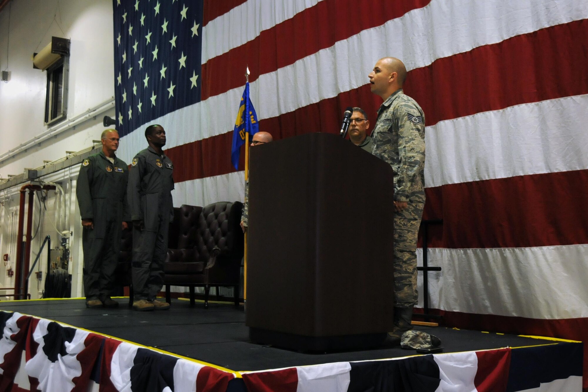 Staff Sgt. Luis Pluguez, 94th Aeromedical Staging Squadron, sings the national anthem during a change of command ceremony at Dobbins Air Reserve Base, Georgia, on July 10, 2016. Col. Patrick Campbell formally assumed command of the 94th Operations Group during the event. (U.S. Air Force photo by Staff Sgt. Alan Abernethy)