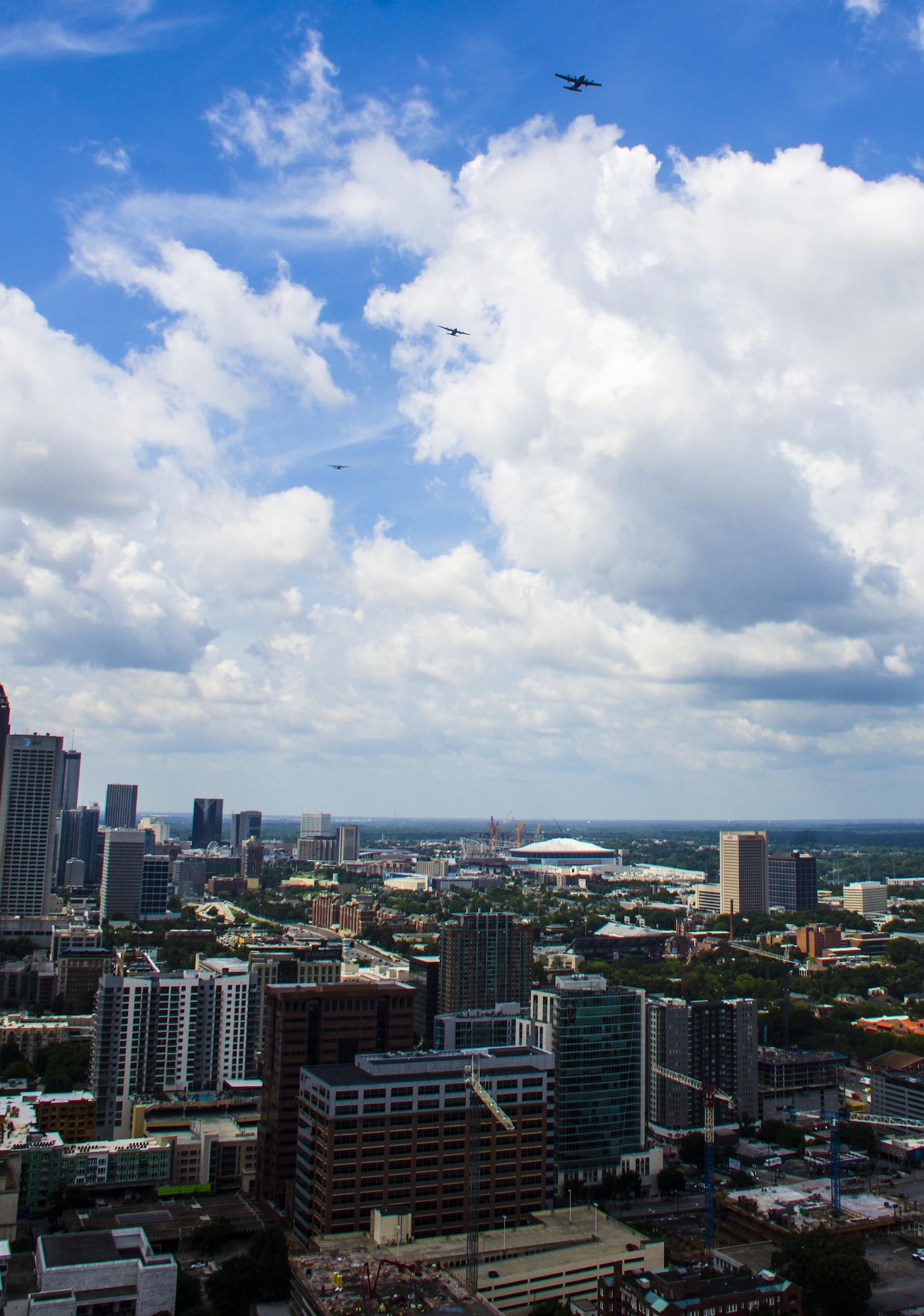 A six-ship C-130 Hercules formation from Dobbins Air Reserve Base, Ga., flies over downtown Atlanta on July 9, 2016. The 94th Airlift Wing conducted proficiency training missions over downtown Atlanta and much of the metro area. (U.S. Air Force photo/Staff Sgt. Daniel Phelps)
