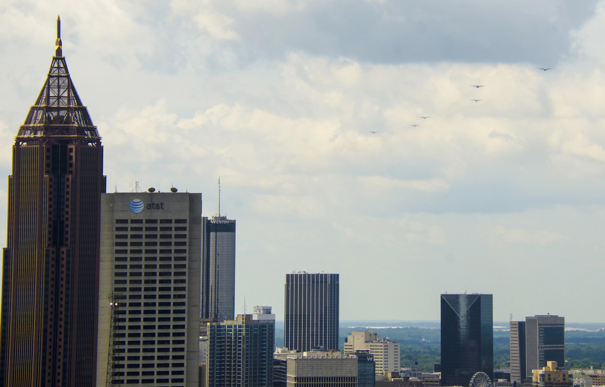 A six-ship C-130 Hercules formation from Dobbins Air Reserve Base, Ga., flies over downtown Atlanta on July 9, 2016. The 94th Airlift Wing conducted proficiency training missions over downtown Atlanta and much of the metro area. (U.S. Air Force photo/Staff Sgt. Daniel Phelps)
