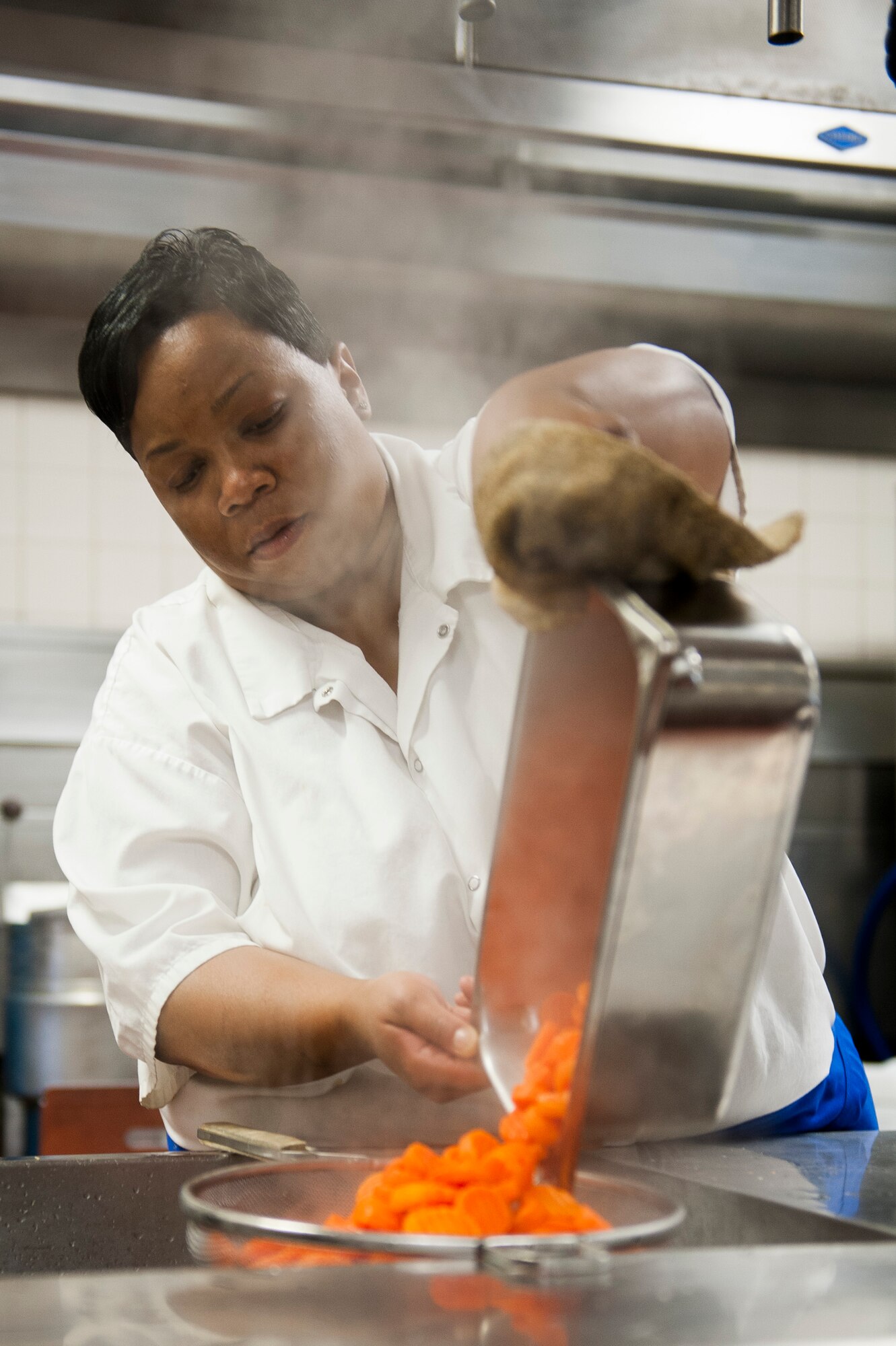 Karen Dorsey, 375th Force Support Squadron chef, prepares a dish for lunch at the Nightingale Inn June 29, 2016, at Scott Air Force Base, Illinois. The Nightingale Inn provides meals for all Airmen living in the dorms, as well as servicemembers temporarily assigned to the base. (U.S. Air Force photo by Staff Sgt. Clayton Lenhardt/Released)