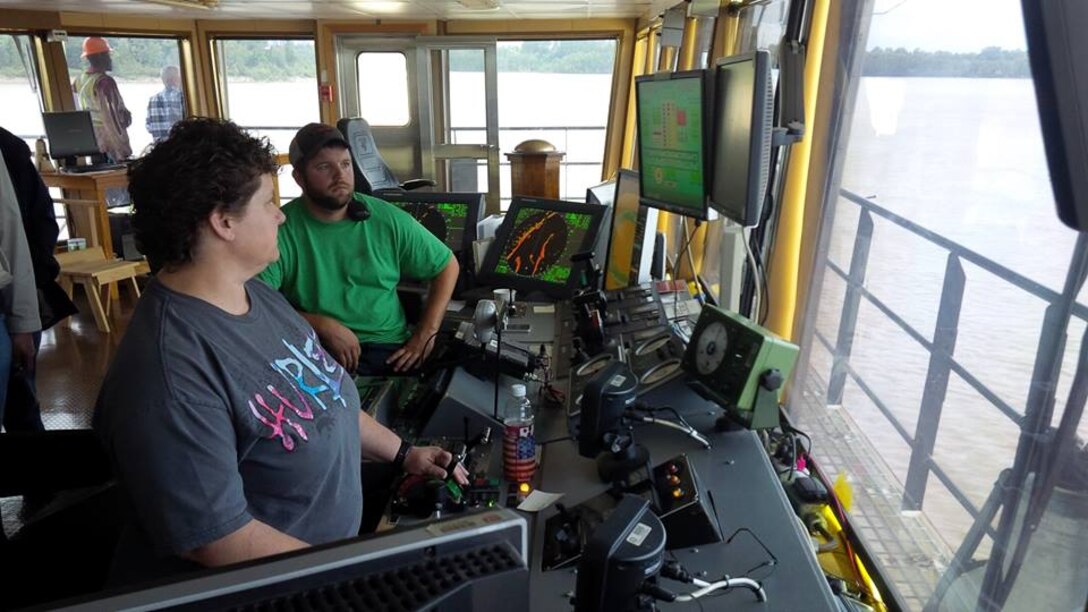 In the pilot house of the USACE Memphis District Dredge Hurley, Stacye Sinn operates the suction to remove silt from the channel as Kendall Turman keeps the Dredge on course. 