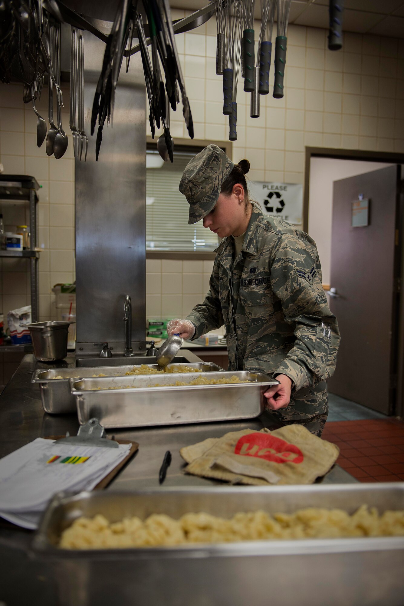 Airman 1st Class Kelly Drury, 126th Air National Guard services apprentice, scoops pasta into a container at the Nightingale Inn Dining Facility at Scott Air Force Base, Illinois, June 29, 2016. The dining facility has been named "Best in Air Force", as well as "Best in Air Mobility Command". (U.S. Air Force photo/Senior Airman Jake Eckhardt)