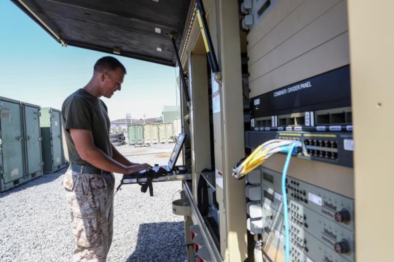 U.S. Marine Cpl. Matthew Peterson works on communication equipment during Command Post Exercise 3 aboard Camp Pendleton, Calif., June 28, 2016. Peterson is a field radio operator with Communications Company, Headquarters Regiment, 1st Marine Logistics Group. During the exercise, Marines with Communications Company proved they could communicate not only within their own subordinate and adjacent units, but also 3rd Marine Air Craft Wing, 1st Marine Division, and I Marine Expeditionary Force. (U.S. Marine Corps photo by Sgt. Laura Gauna/ Released)