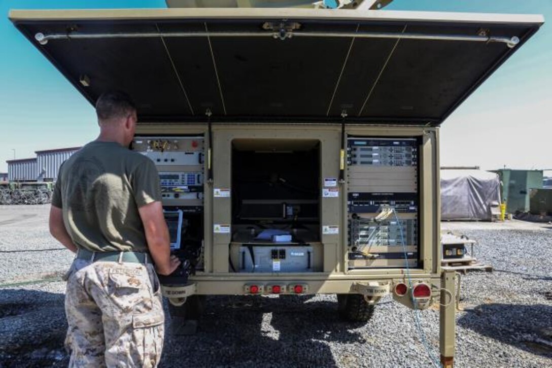 U.S. Marine Cpl. Matthew Peterson works on communication equipment during Command Post Exercise 3 aboard Camp Pendleton, Calif., June 28, 2016. Peterson is a field radio operator with Communications Company, Headquarters Regiment, 1st Marine Logistics Group. During the exercise, Marines with Communications Company proved they could communicate not only within their own subordinate and adjacent units, but also 3rd Marine Air Craft Wing, 1st Marine Division, and I Marine Expeditionary Force. (U.S. Marine Corps photo by Sgt. Laura Gauna/ Released)