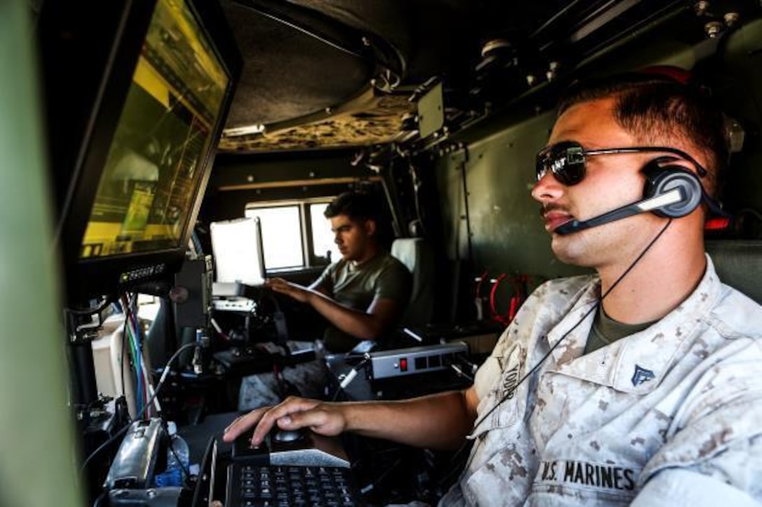U.S. Marine Cpl. James Yoder conducts radio checks during Command Post Exercise 3 aboard Camp Pendleton, Calif., June 28, 2016. Yoder is a technical controller with Communications Company, Headquarters Regiment, 1st Marine Logistics Group. During the exercise, Marines with Communications Company proved they could communicate not only within their own subordinate and adjacent units, but also 3rd Marine Air Craft Wing, 1st Marine Division, and I Marine Expeditionary Force. (U.S. Marine Corps photo by Sgt. Laura Gauna/ Released)
