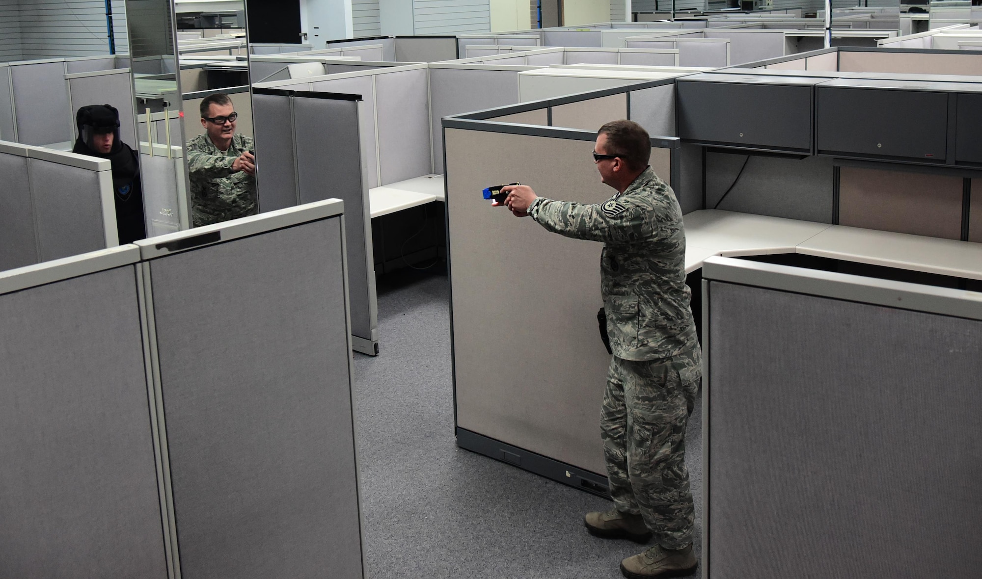 PETERSON AIR FORCE BASE, Colo. – Tech. Sgt. Brett Marzo, 21st Security Forces Squadron Military Working Dog trainer, attempts to talk down a hostile subject in a simulated scenario during Baton and Taser training at Peterson Air Force Base, Colo., July 7, 2016. Trainees are taught to attempt to talk down a situation before resulting to force to subdue an uncooperative suspect. (U.S. Air Force photo by Staff Sgt. Amber Grimm)