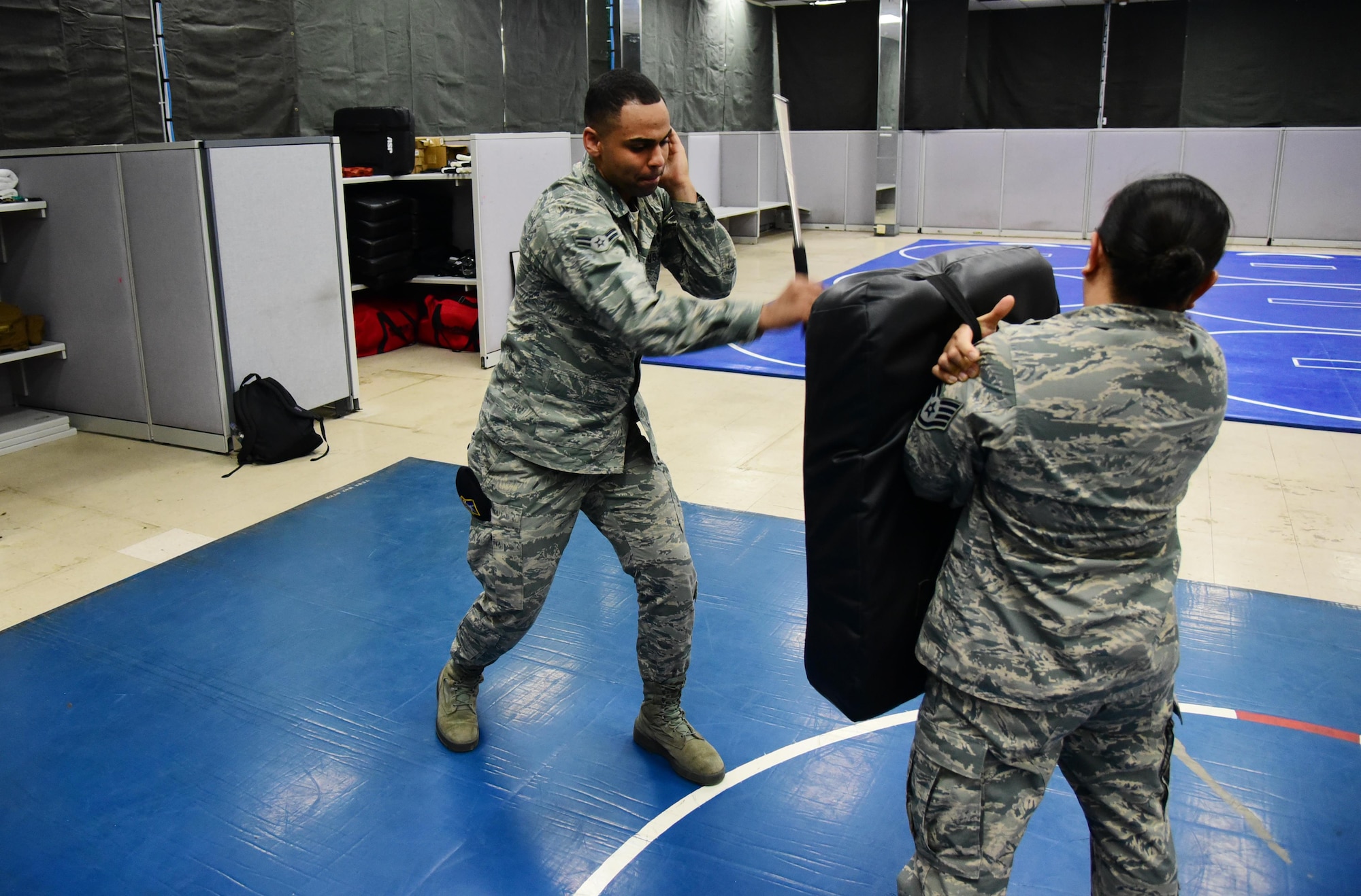 PETERSON AIR FORCE BASE, Colo. – Airman 1st Class Mekah Baker, 21st Security Forces Squadron patrolman, practices his 45 degree, reaction side strike during the practical application portion of the Baton and Taser training course at Peterson Air Force Base, Colo., July 7, 2016. Baton training emphasized the officers need for balance between gaining control of a subject versus causing harm. (U.S. Air Force photo by Staff Sgt. Amber Grimm)
