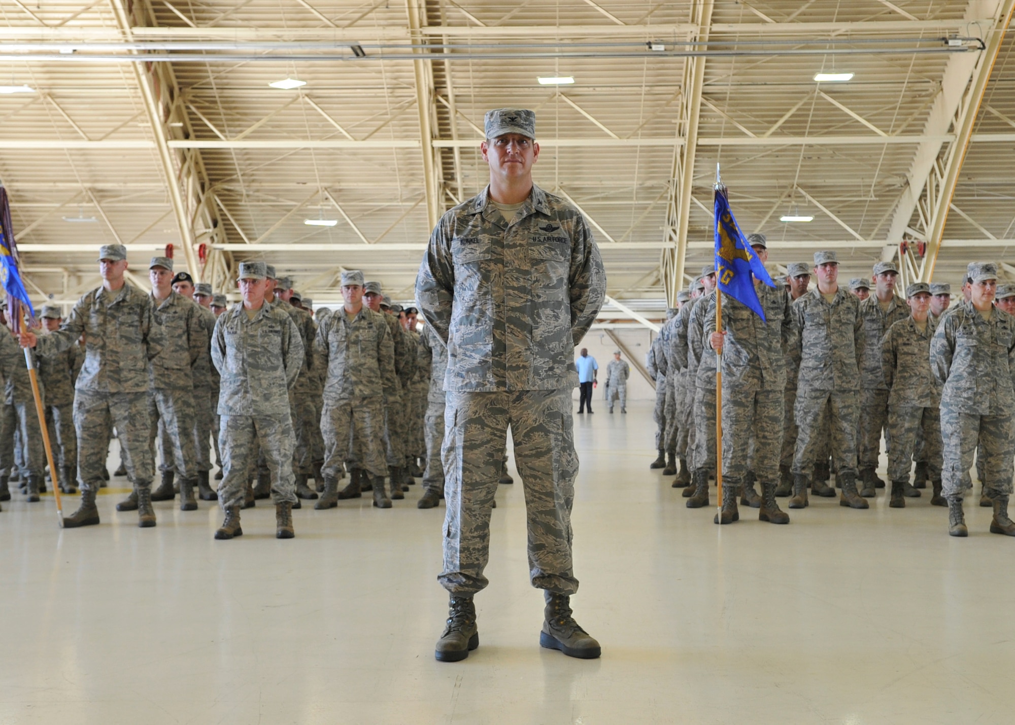 U.S. Air Force Col. Joseph Kunkel, vice commander of the 325th Fighter Wing, stands in front of a formation of Team Tyndall Airmen July 11, at Tyndall Air Force Base, Fla. Col. Derek C. France relinquished  command of the 325th FW to Col. Michael Hernandez during the ceremony. (U.S. Air Force photo by Senior Airman Sergio A. Gamboa/Released)