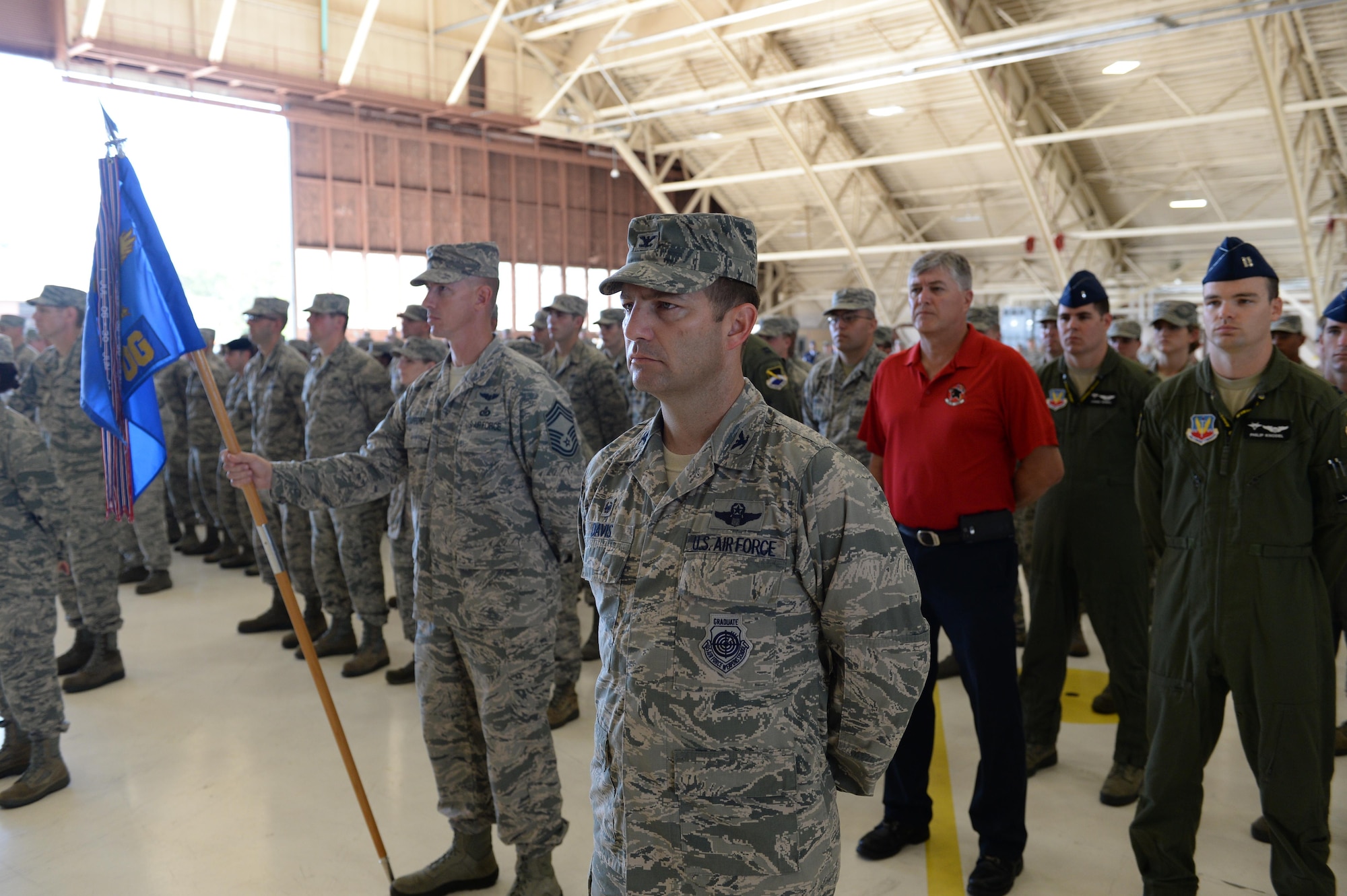 Team Tyndall members stand at parade rest during the 325th Fighter Wing change of command ceremony, July 11, at Tyndall Air Force Base, Fla. Col. Derek C. France relinquished command of the 325th Fighter Wing to Col. Michael Hernandez during the ceremony.  (U.S. Air Force photo by Airman 1st Class Cody R. Miller/Released)