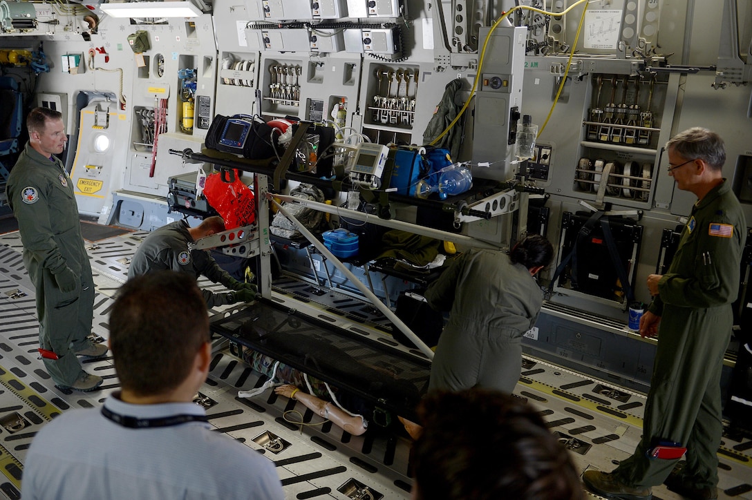 Members of the 446th Aeromedical Evacuation Squadron demonstrate medical equipment during the 50th Anniversary of the Port of Moses Lake July 1, 2016 at Grant County International Airport, Wash. More than 2,800 members of the local community walked around the Grant County International Airport and toured different aircraft, both military and civilian. (U.S. Air Force photo/Senior Airman Divine Cox)