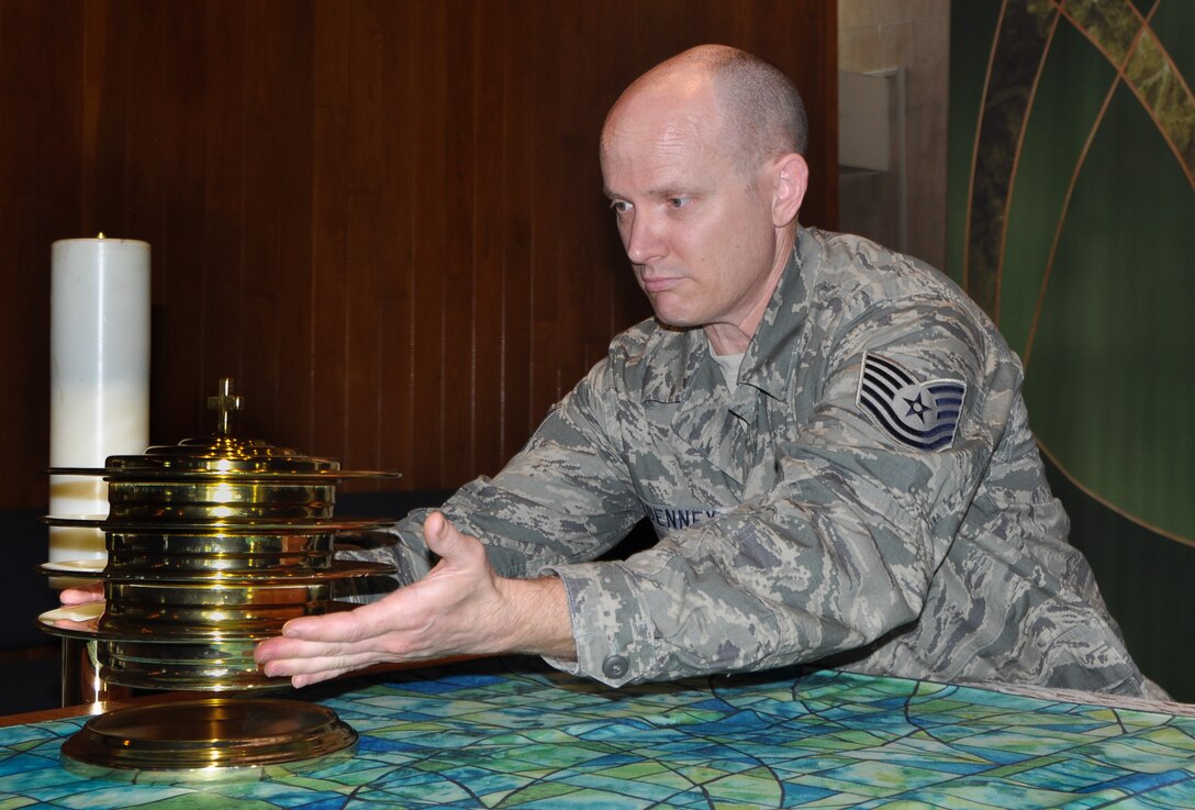 Tech. Sgt. Elliot Denny, 944th Fighter Wing, chaplain assistant sets up for a protestant chapel service on June 30, 2016 at Kadena Air Base Japan.   As a Citizen Airman who works as a postman in Tucson Arizona, he came to the wing over three years ago from active duty where he was a weapons loader.  The opportunity to serve his annual with the wing as part of “Operation Patriot Habu,” is important because it provides him with the ability work with active duty counterparts and train in areas that are not available at home station.  He and other members of the 944th Chapel staff have mixed in with the 18th AB chapel staff and provided some much needed manpower relief.   (U.S. Air Force photo by Tech. Sgt. Barbara Plante)